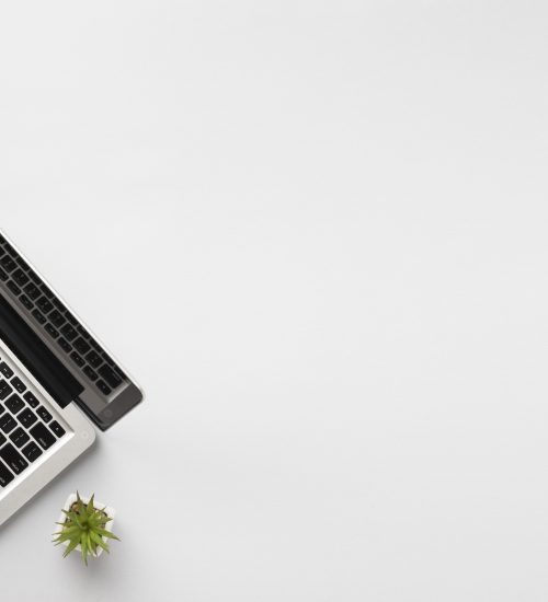 top-view-person-writing-laptop-with-copy-space